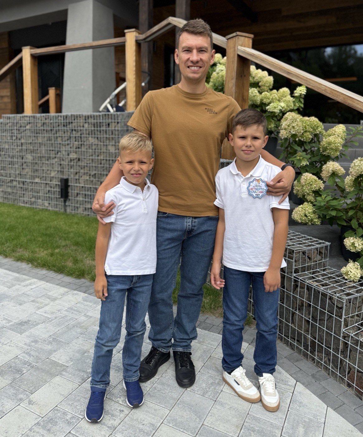 Roman with his two sons on the first day of school